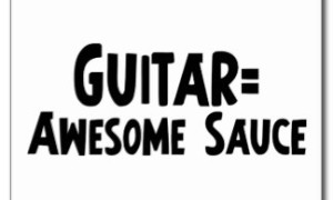 Postcard reading "Guitar = Awesome Sauce" in bold hand-drawn black lettering on a white background