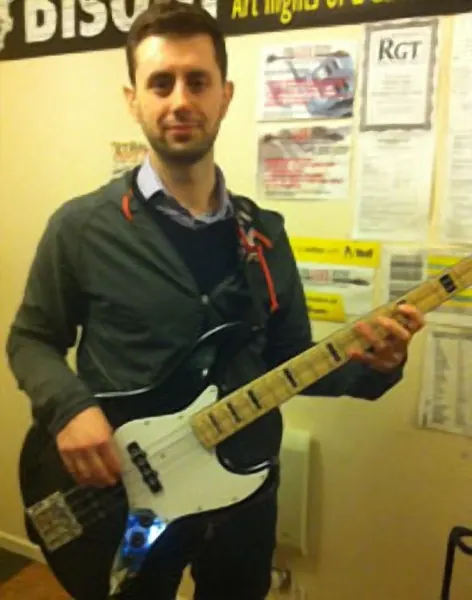 Alex Priestley plays bass guitar with Malcolm Callus at Cool Gool Music, Canada Water SE16
