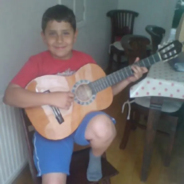 Cool Gool Music guitar student Alexander Bittar with their classical guitar, London SE16
