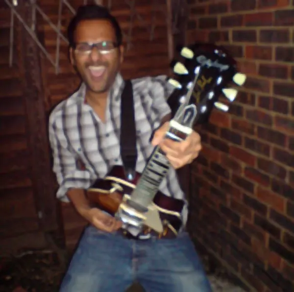 Cool Gool Music guitar student Amit Chatterjee with their electric guitar, London SE16