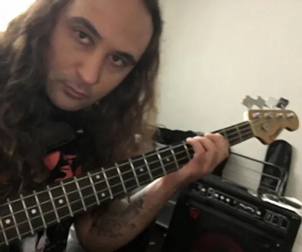 Guitar pupil Aydin Arif and their bass guitar, taught by Malcolm Callus in London SE16