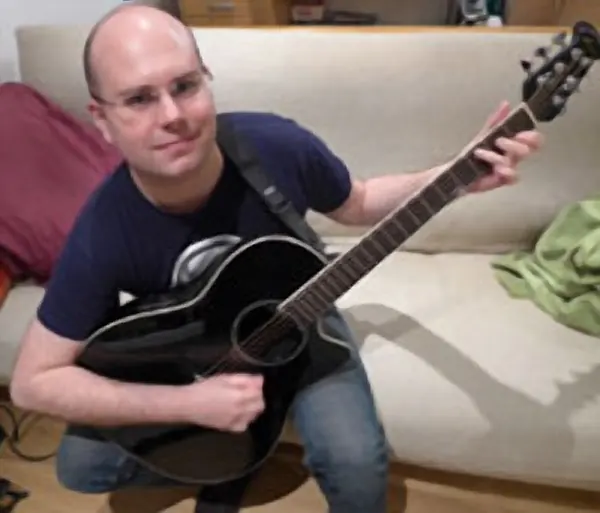 Electric and acoustic guitar student Bastian Didier of Cool Gool Music, Malcolm Callus, London SE16