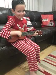 Charlie Walton holding their ukulele — Cool Gool Music guitar lessons, London SE16