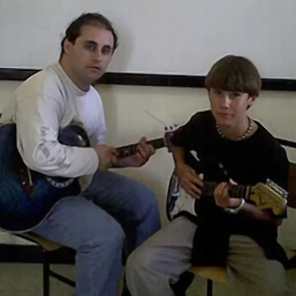 Guitar pupil Emvin Taylor and their electric guitar, taught by Malcolm Callus in London SE16