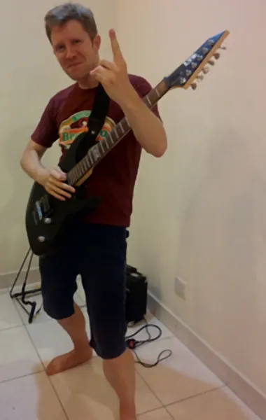 Cool Gool Music student Graham Seabrook pictured with their electric guitar, south east London