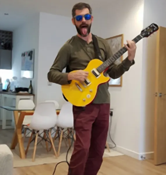Joe "Slow motion hand" Ardini plays electric guitar with Malcolm Callus at Cool Gool Music, Canada Water SE16