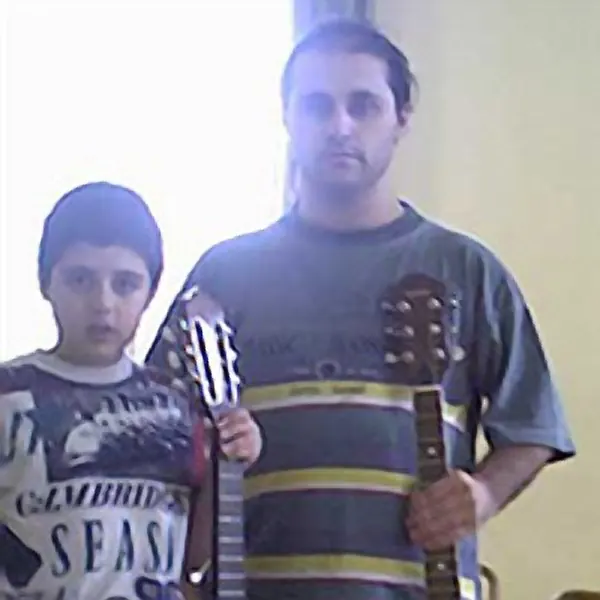 Jonathan Ebejer with the classical guitar they play in lessons at Cool Gool Music, south east London