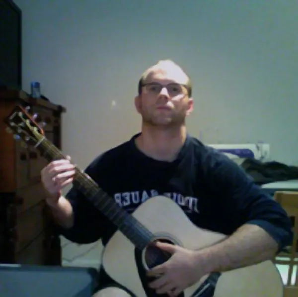 Kevin Broughton and the acoustic guitar they learn on, Cool Gool Music guitar lessons in Rotherhithe