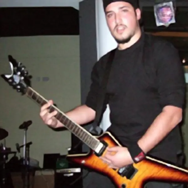 Guitar pupil Norbert Scicluna and their electric guitar, taught by Malcolm Callus in London SE16