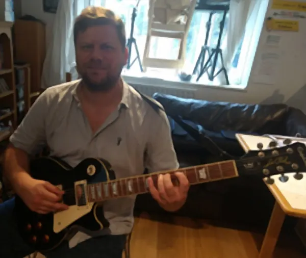 Paul Case with the electric guitar they play in lessons at Cool Gool Music, south east London