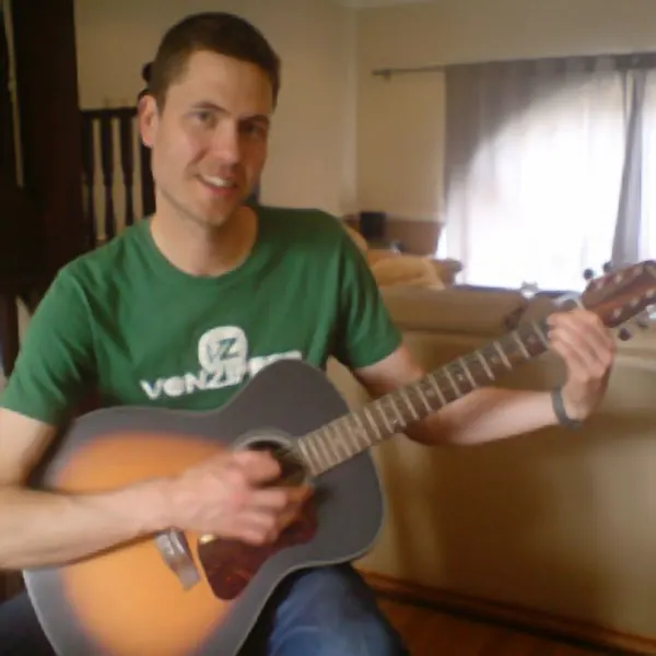 Rohin Imberger with the acoustic guitar they play in lessons at Cool Gool Music, south east London