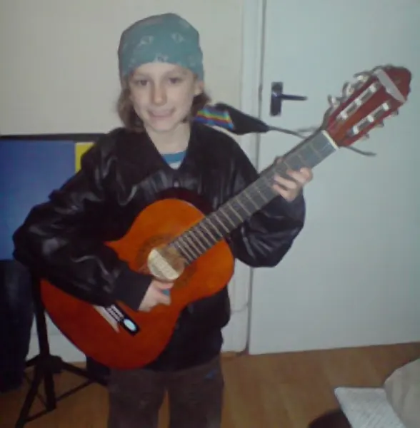 Cool Gool Music student Roscoe Meherin pictured with their electric and acoustic guitar, south east London