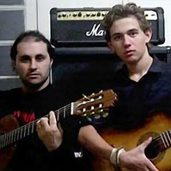 Sebastian Cachia plays acoustic guitar with Malcolm Callus at Cool Gool Music, Canada Water SE16
