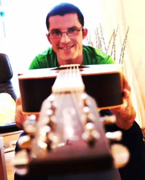 Acoustic guitar student Tristan Barraclough of Cool Gool Music, Malcolm Callus, London SE16