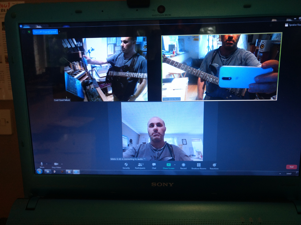 An online guitar lesson on a laptop screen, showing the main camera, the guitar-cam angle on the fingerboard, and the student's own view